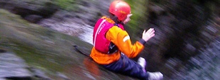 A lake district rush canyoning down the rock slide Church Beck.